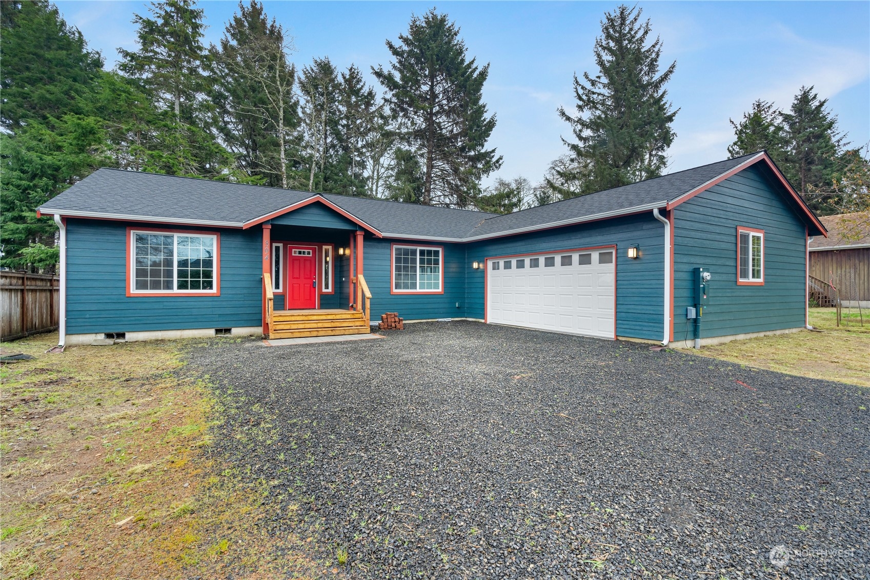 a view of large house with a yard and garage