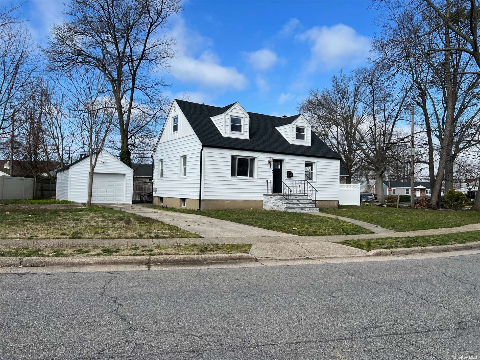 a view of house with a yard