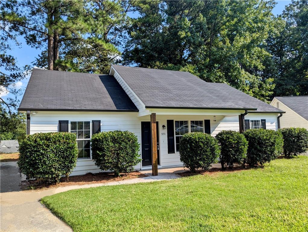 front view of a house with a yard