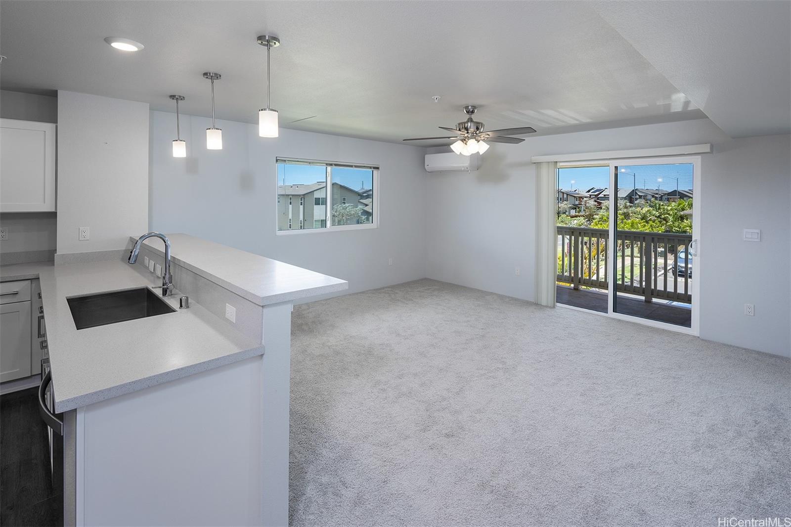 a view of a kitchen with a sink and chandelier