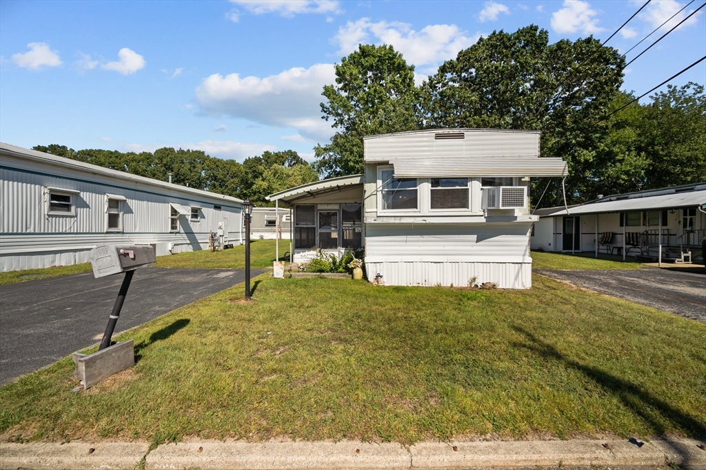 front view of a house with a yard