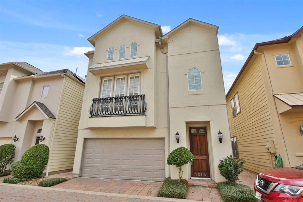 a front view of a house with garage