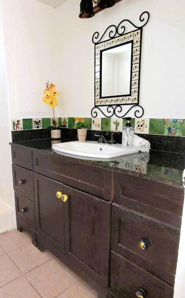 a bathroom with a sink and a mirror