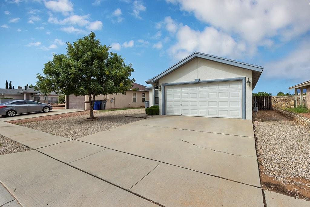 a view of garage and yard