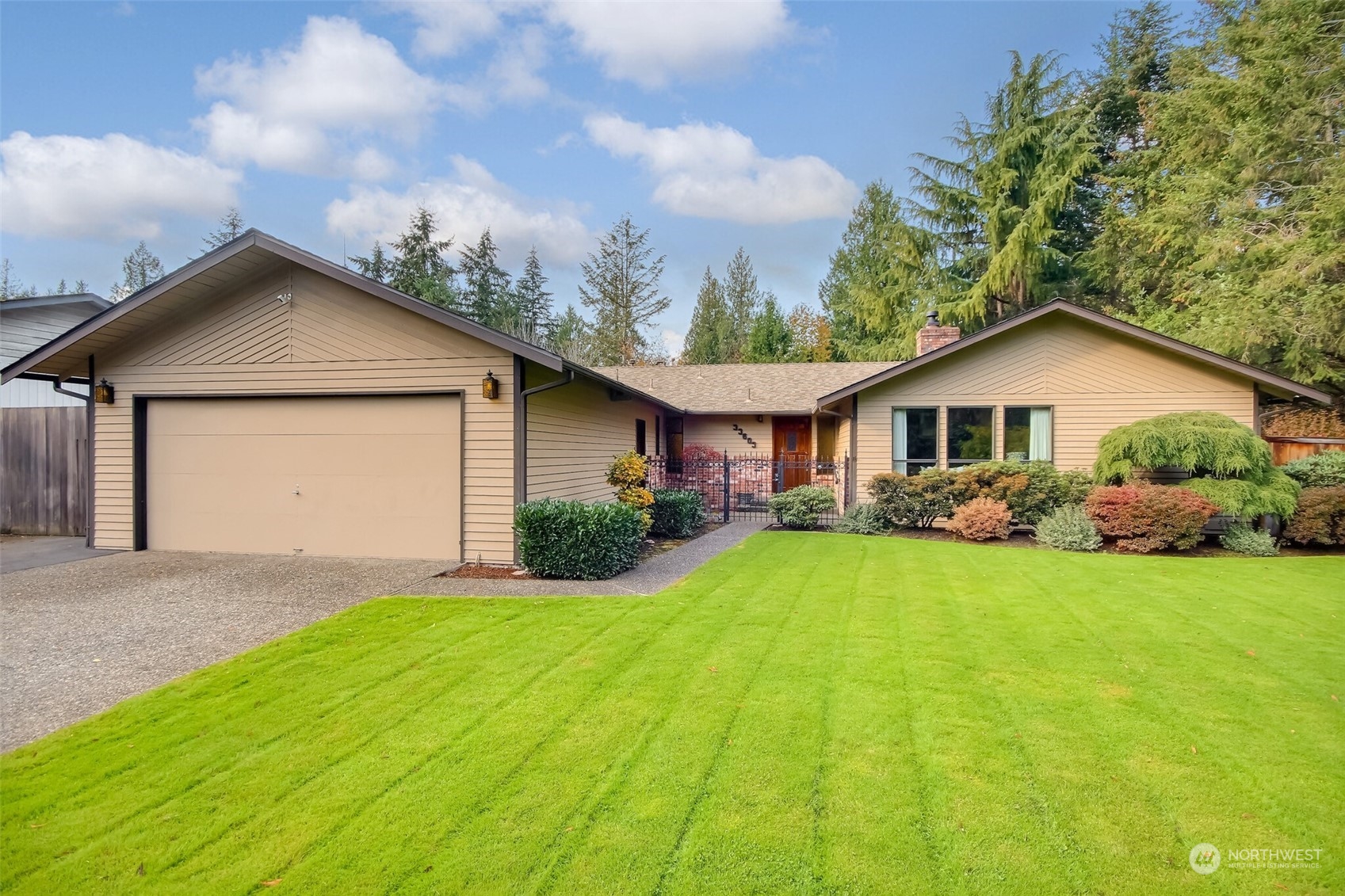 a front view of house with yard and green space