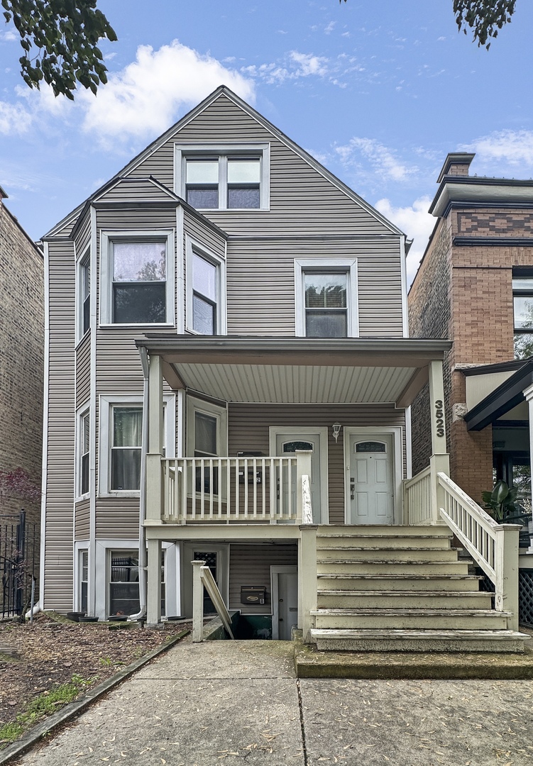 a front view of residential houses with stairs