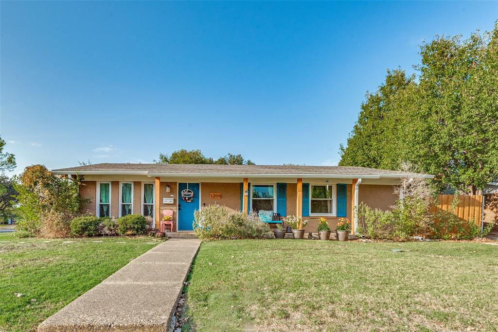 front view of a house and a yard