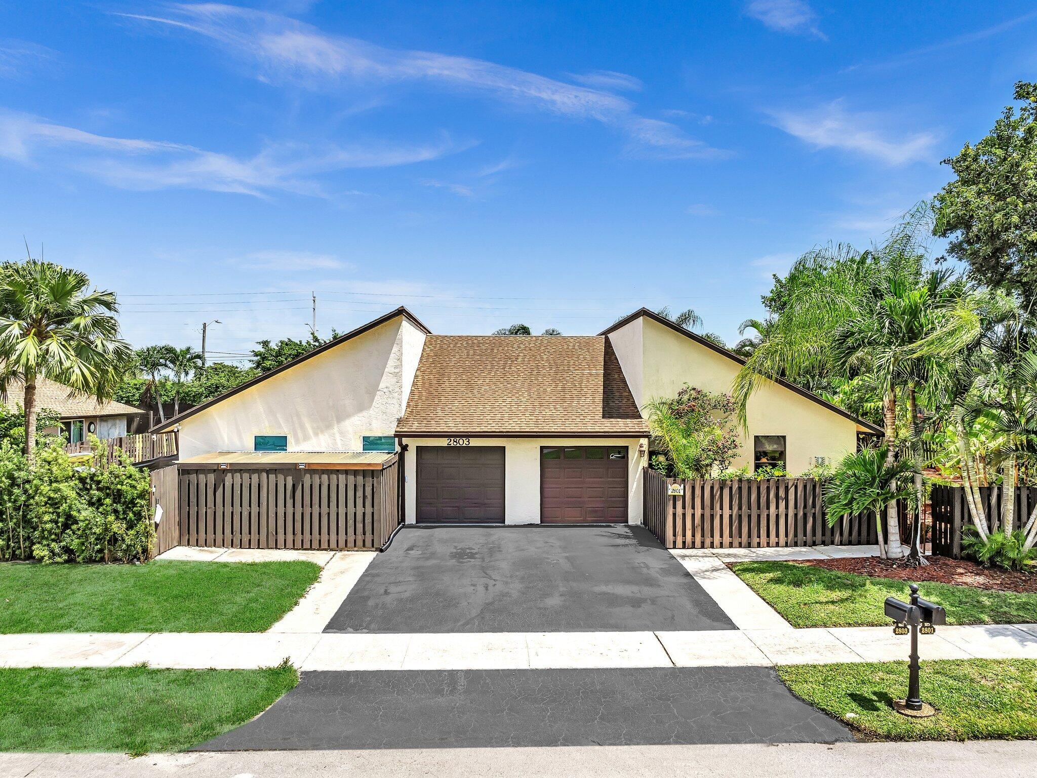 a front view of a house with yard