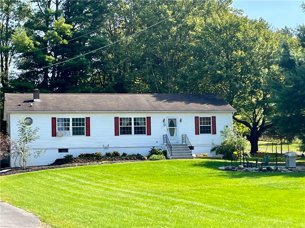 View of front of house with a front yard