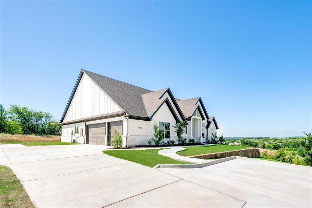 a view of house with yard and street view