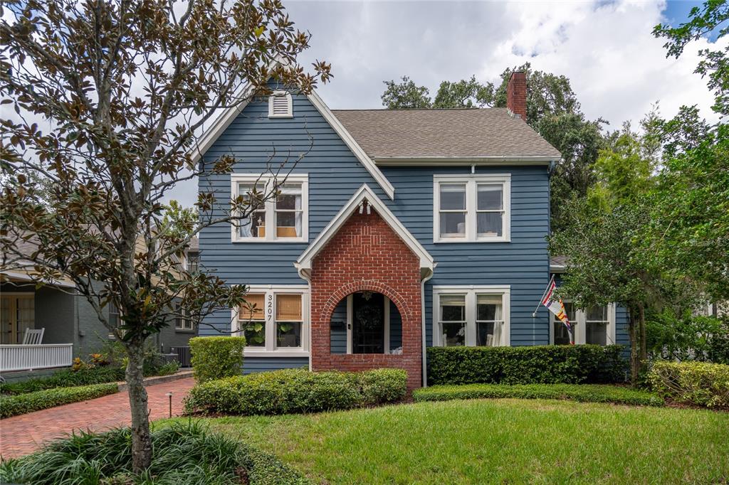 front view of a house with a yard