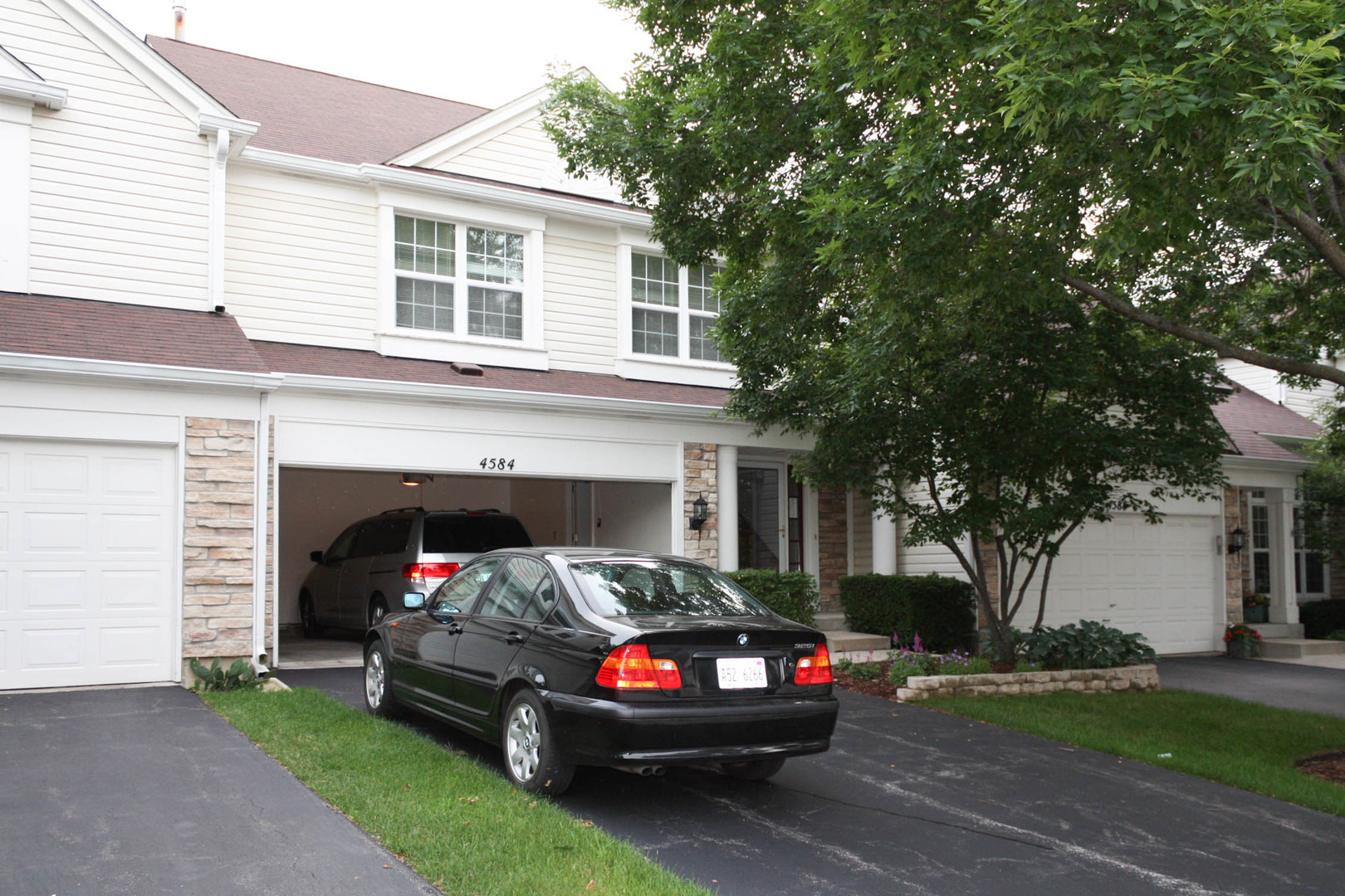 a view of a car parked in front of a house