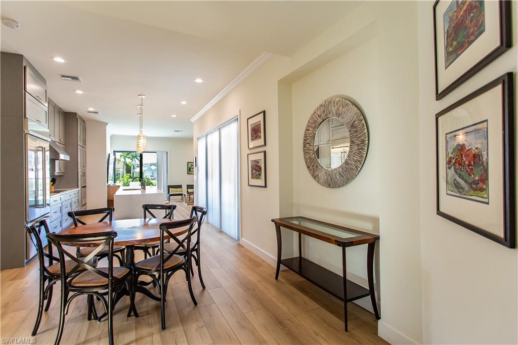 a dining room with furniture and a window