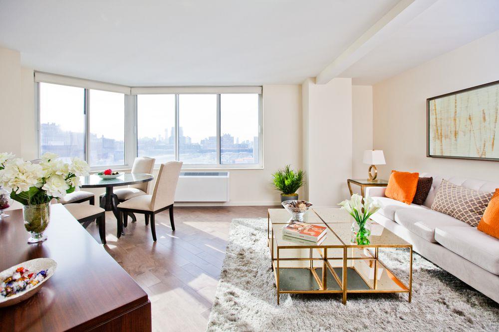 a living room with furniture and a large window