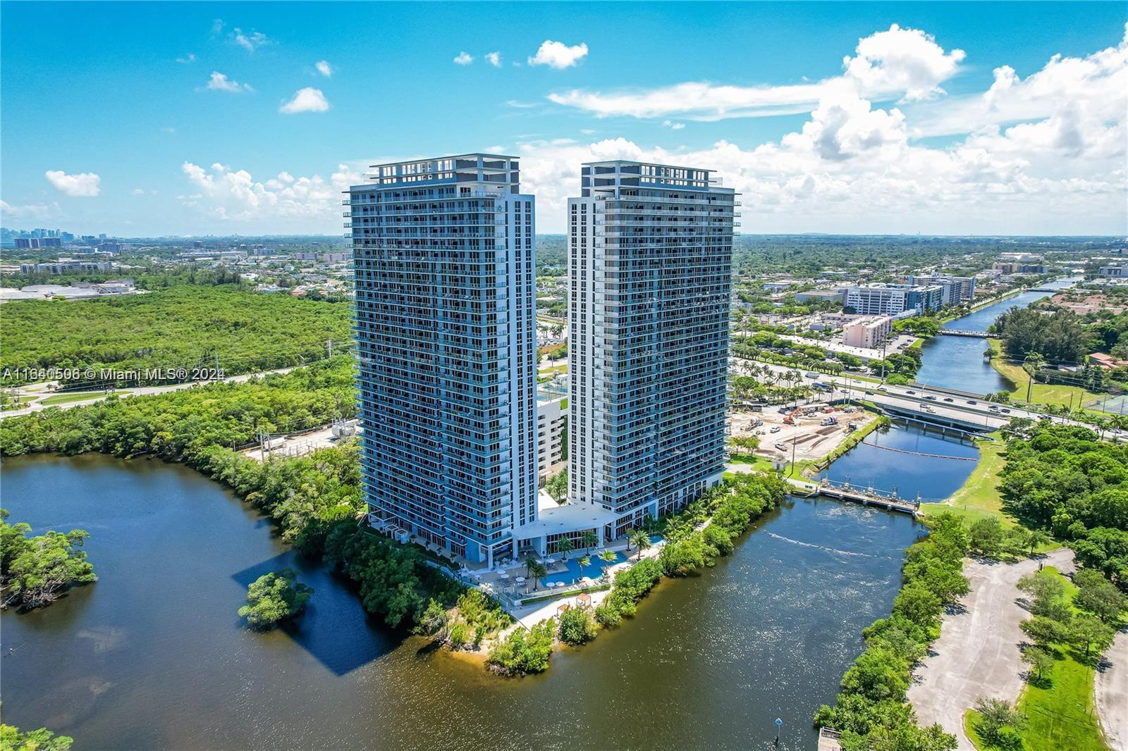 a view of a city with tall buildings