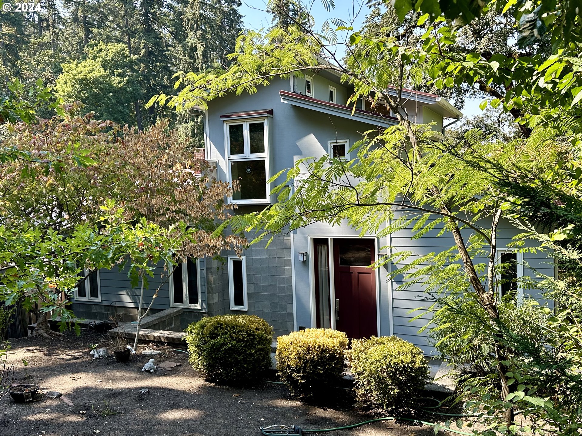 a front view of a house with a yard