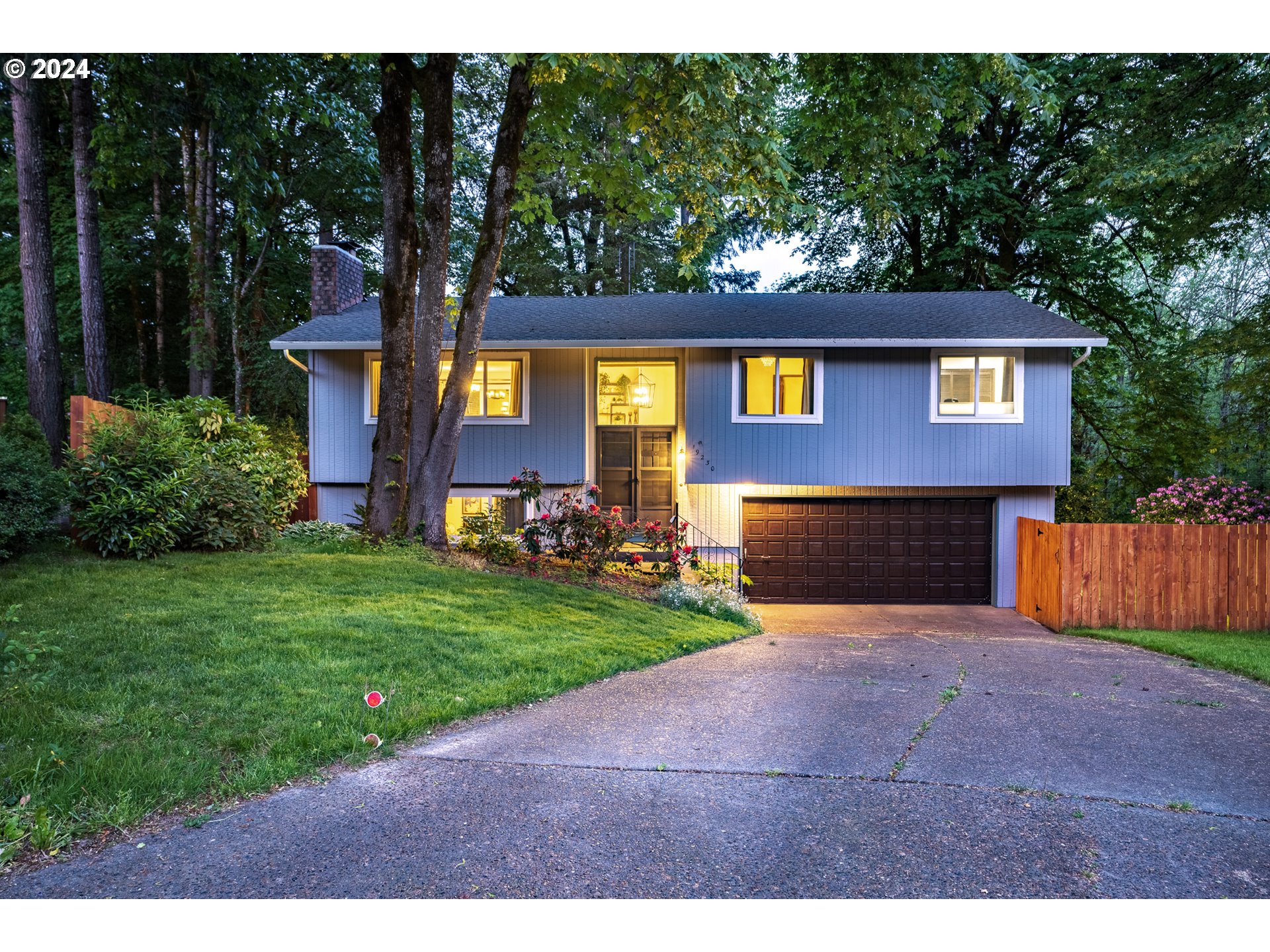 a front view of a house with yard