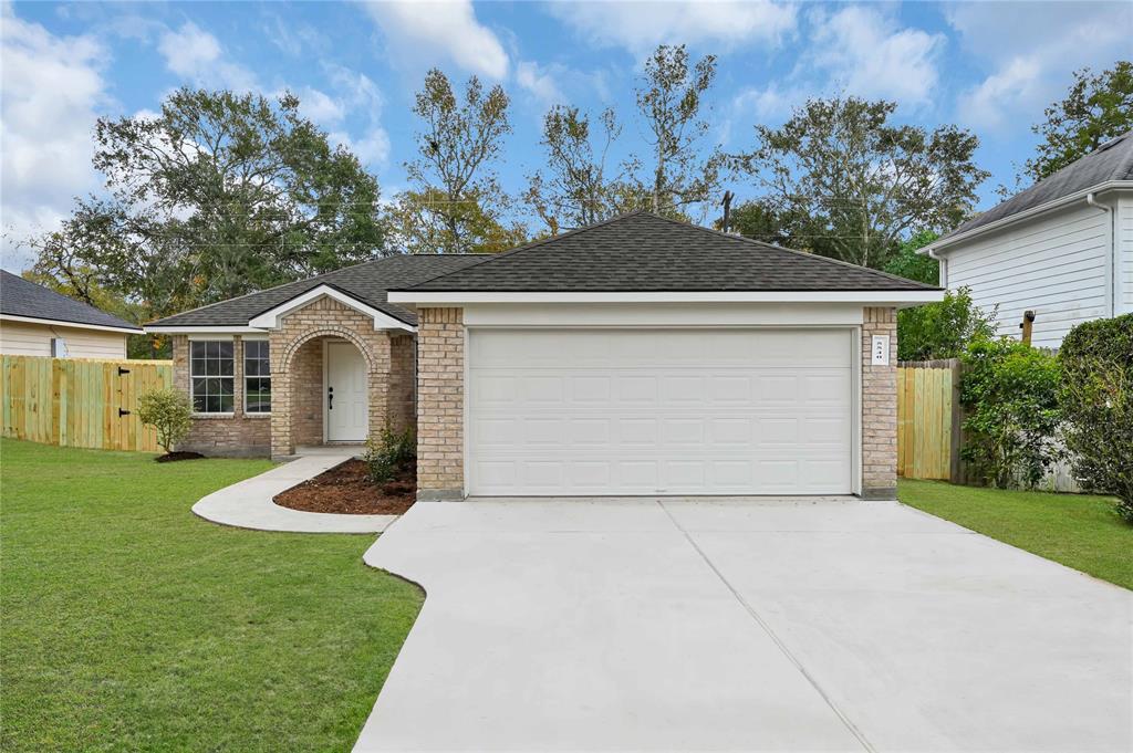 a front view of a house with yard