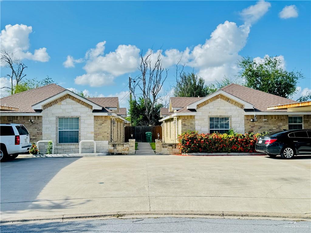 a view of house and a yard