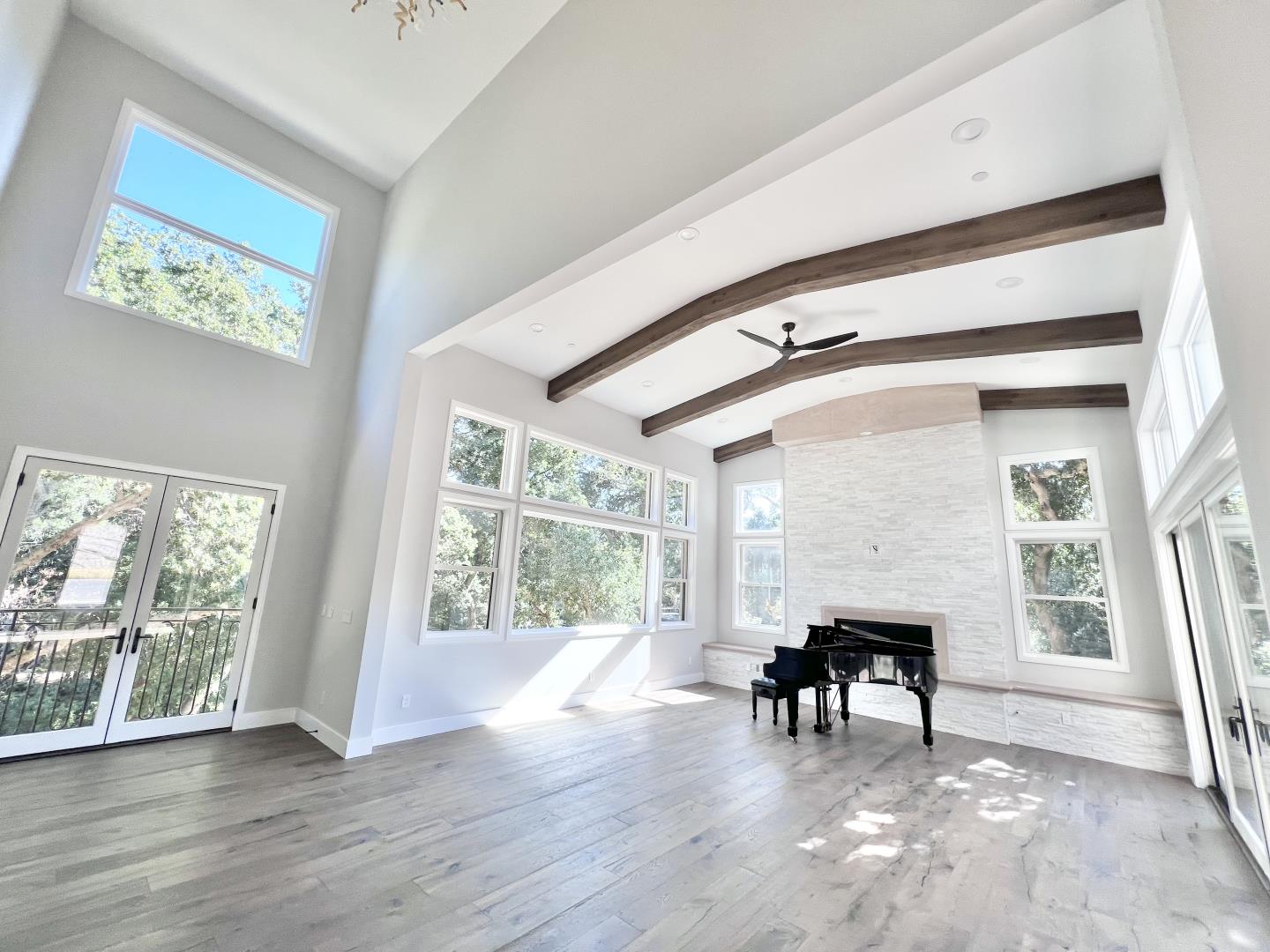 a view of an entryway with wooden floor and windows