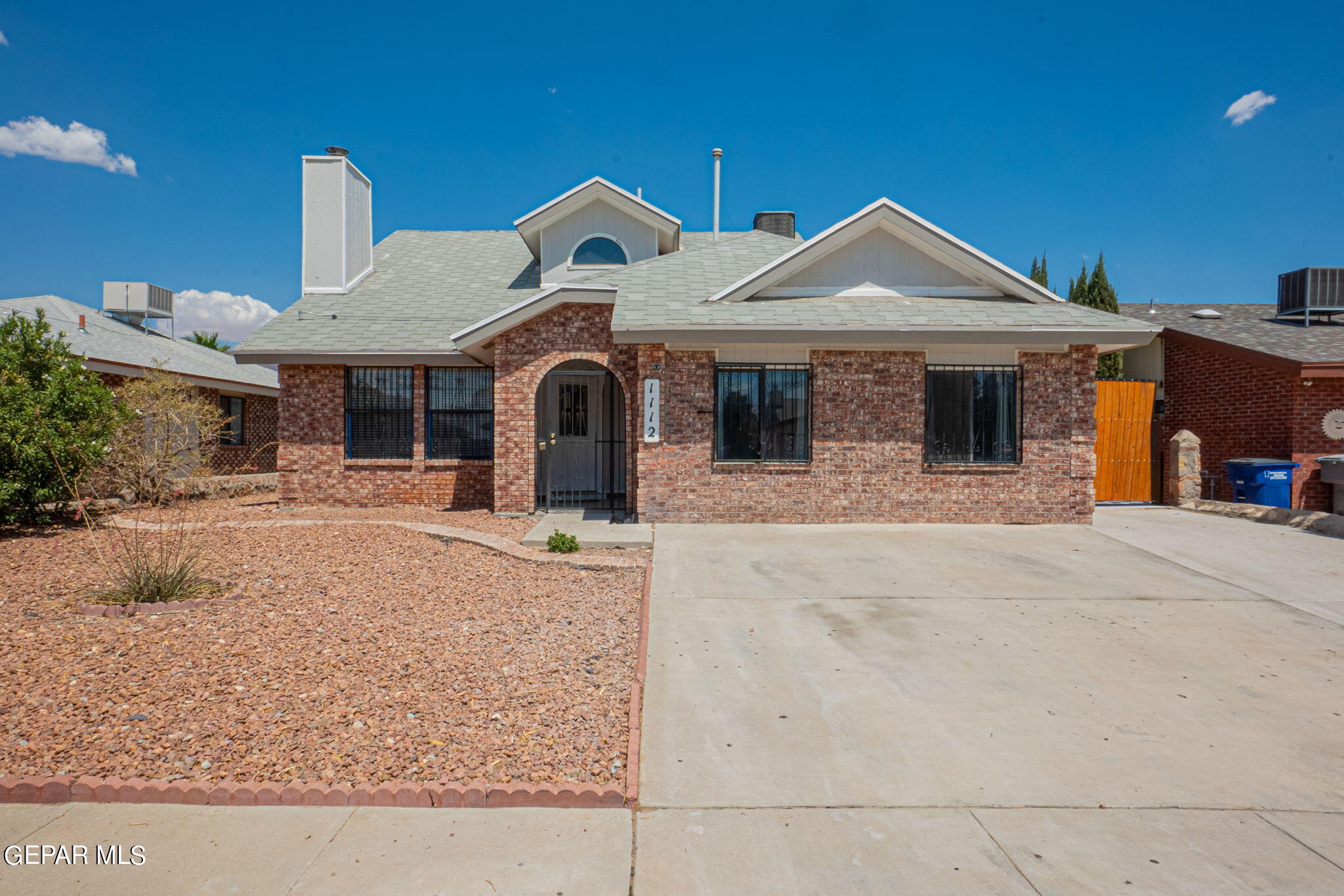 a front view of a house with yard