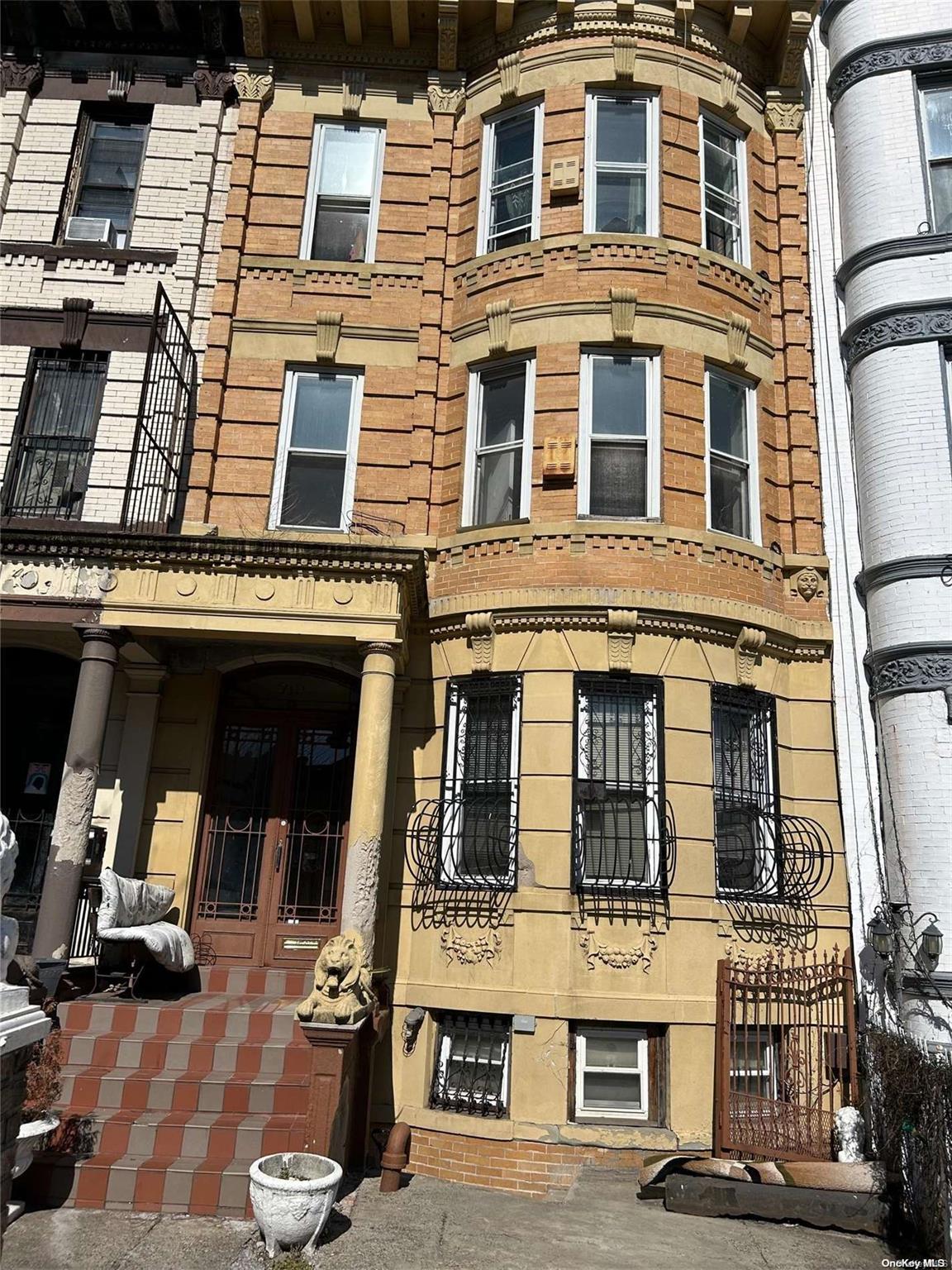 a front view of a building with many windows