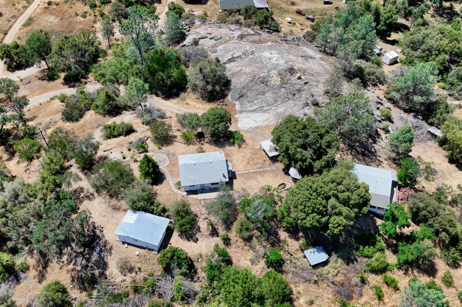 an aerial view of house with yard