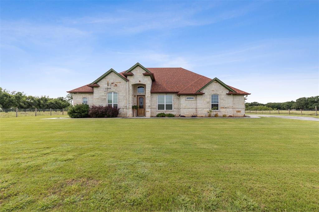 a view of a house with a big yard