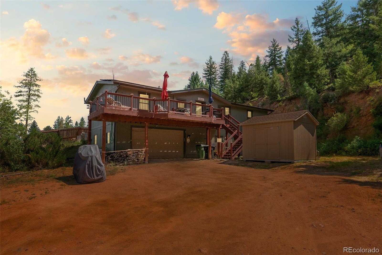 a view of a big house with large trees