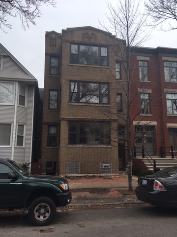 a car parked in front of a building