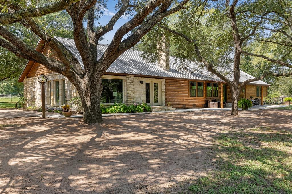 a view of a trees in front of a house