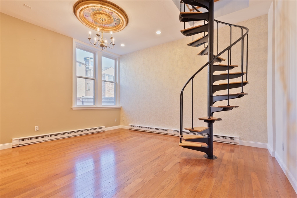 wooden floor with a window in a room