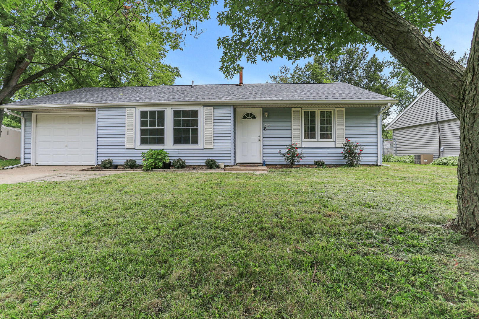 front view of a house with a yard