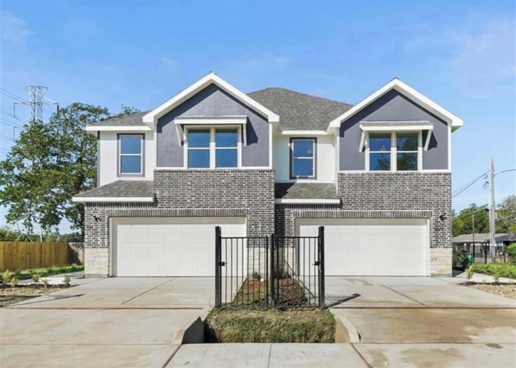 a front view of a house with garage