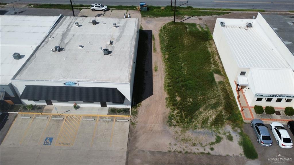 an aerial view of a residential houses with outdoor space