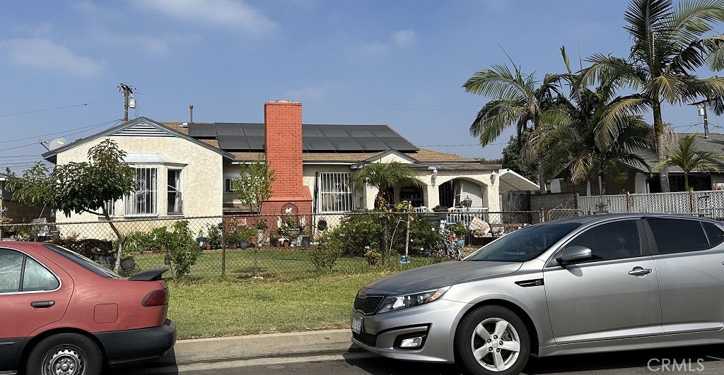 a front view of a house with parking space