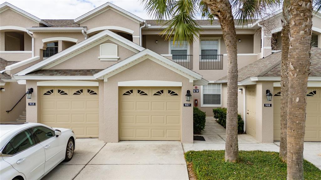 a front view of a house with garage