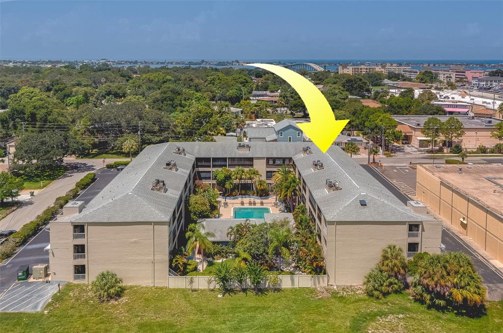 an aerial view of a house with a swimming pool