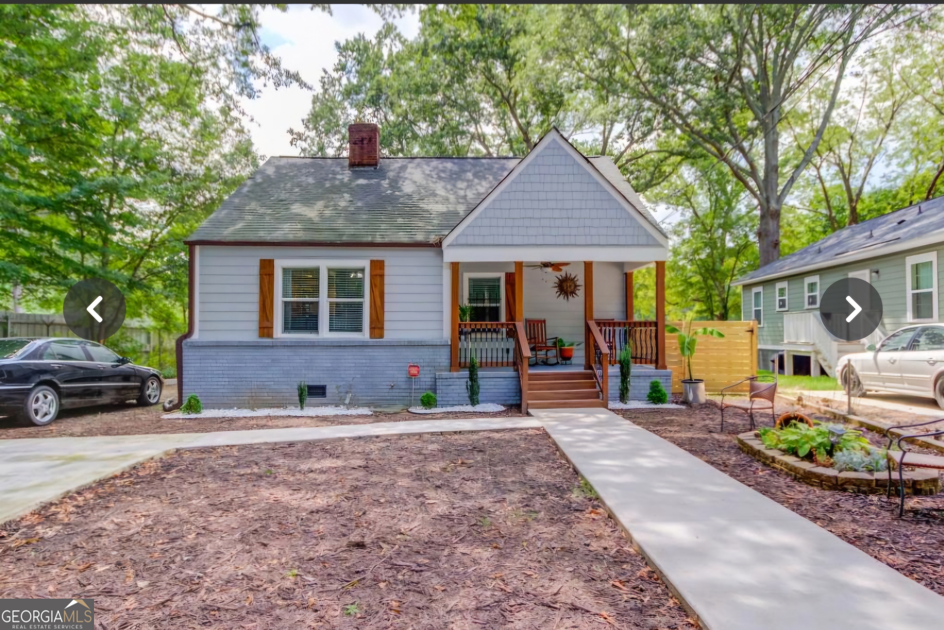 a front view of a house with garden