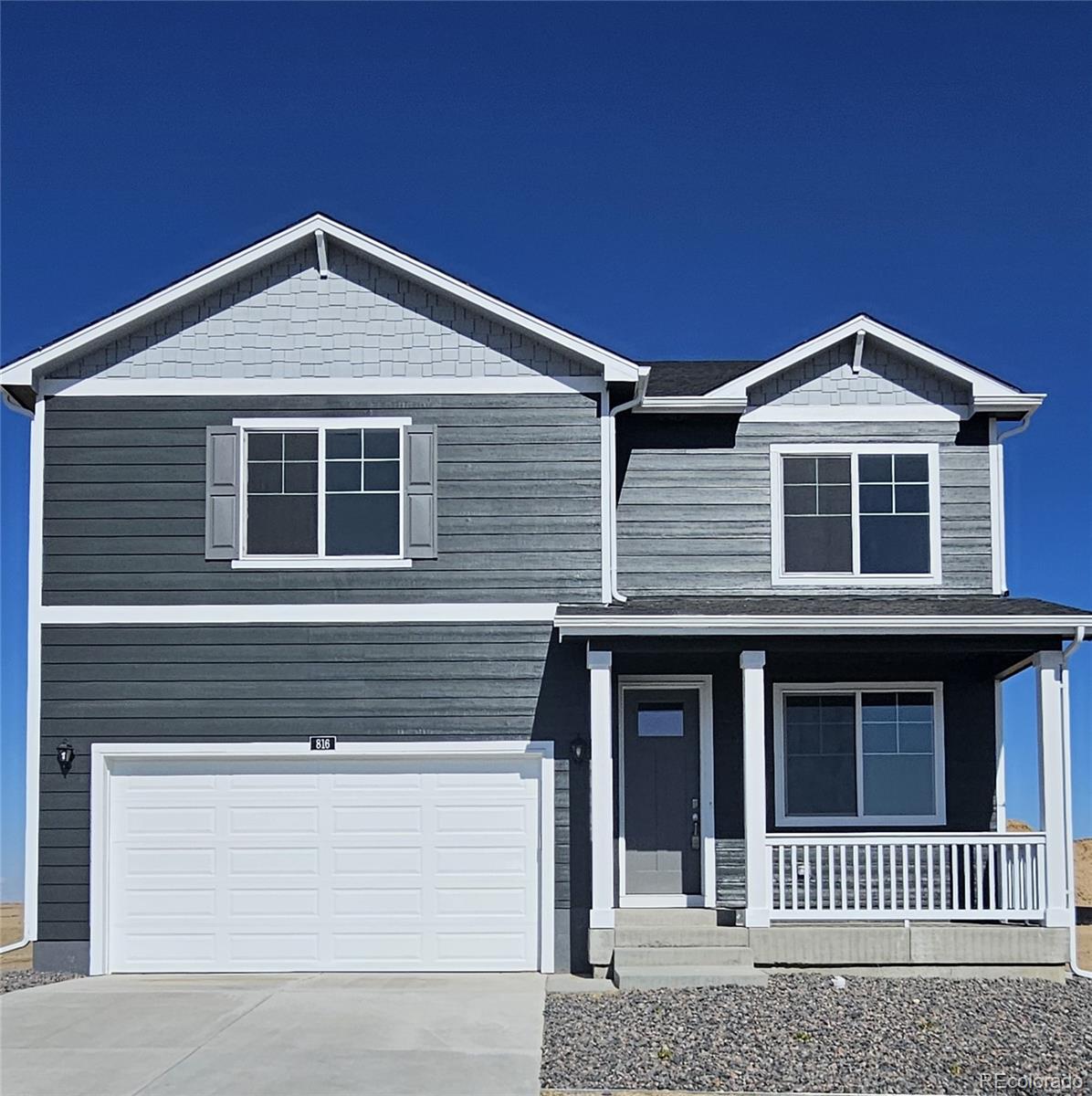 a front view of a house with a garage