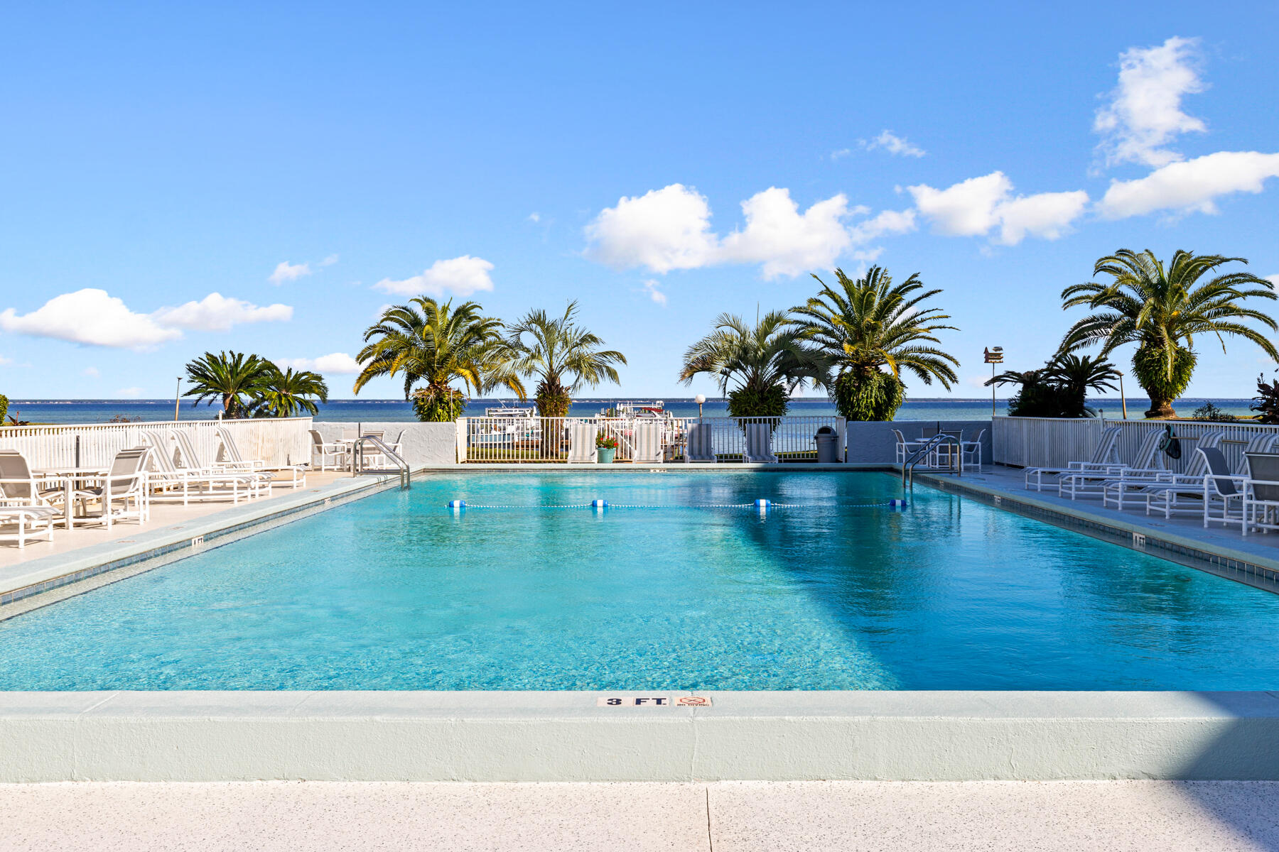 a view of a swimming pool with an outdoor space and seating area