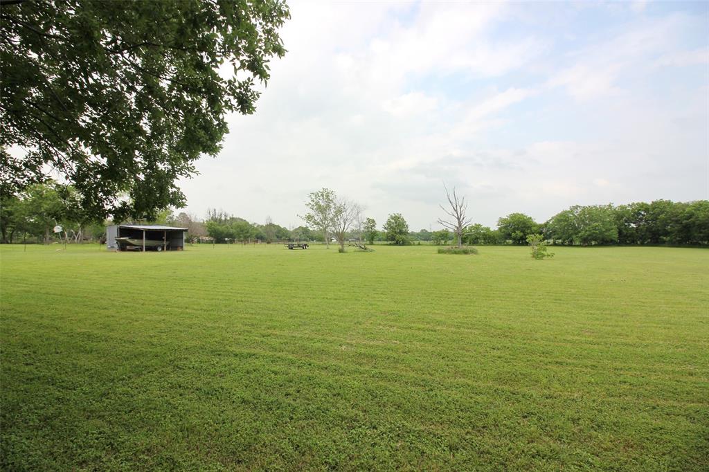 a view of a lake with a big yard