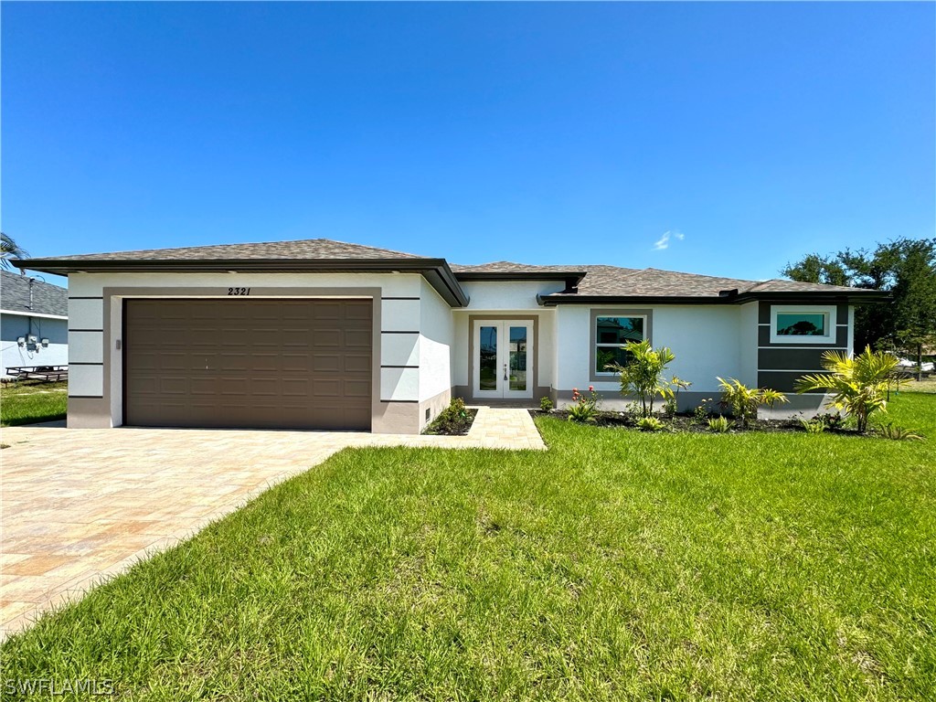 a front view of house with yard and outdoor seating