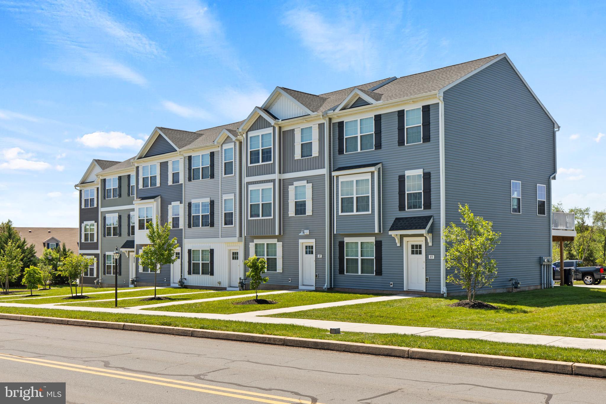 a view of a building with a yard