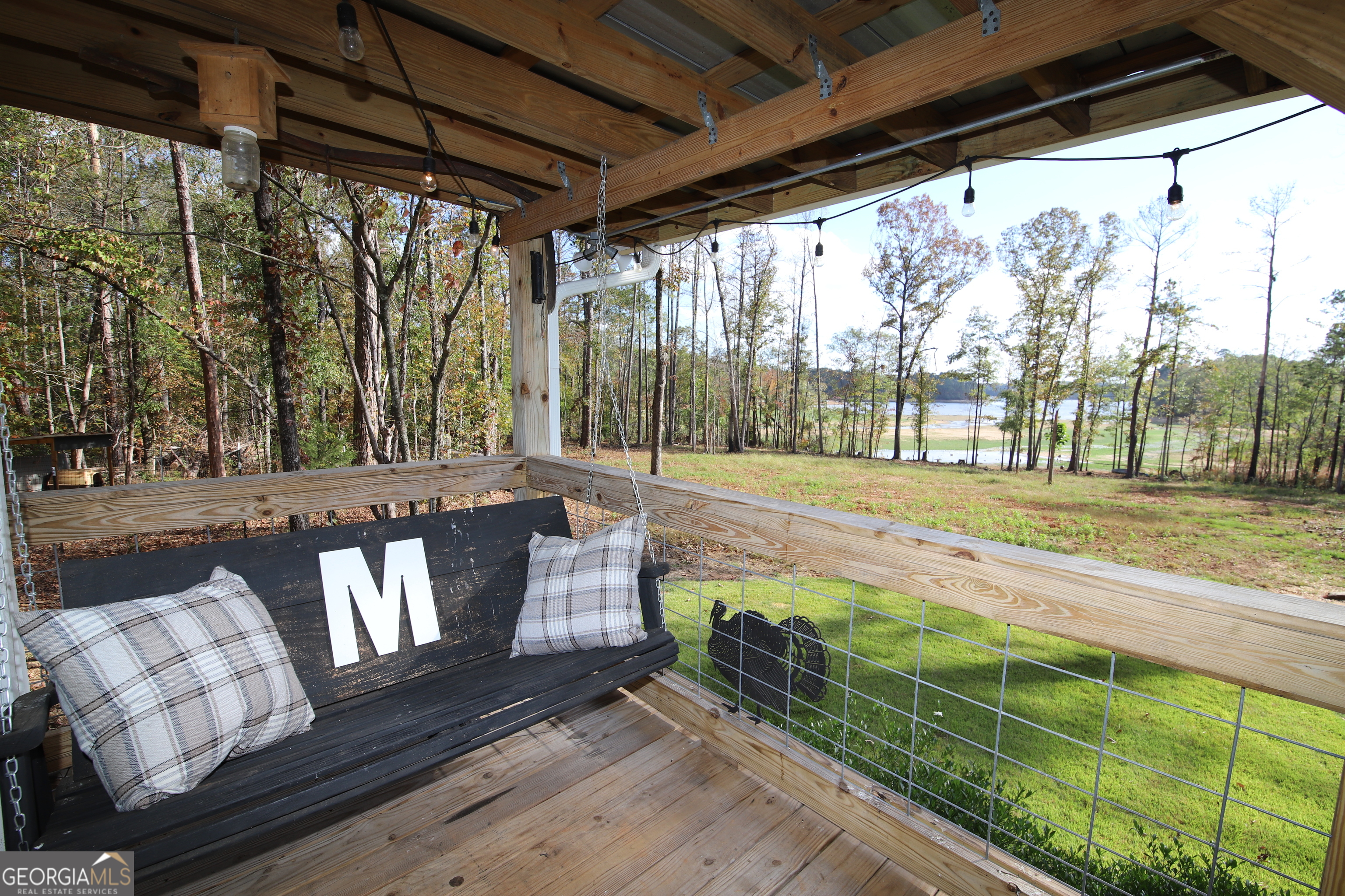 a view of a porch with wooden floor