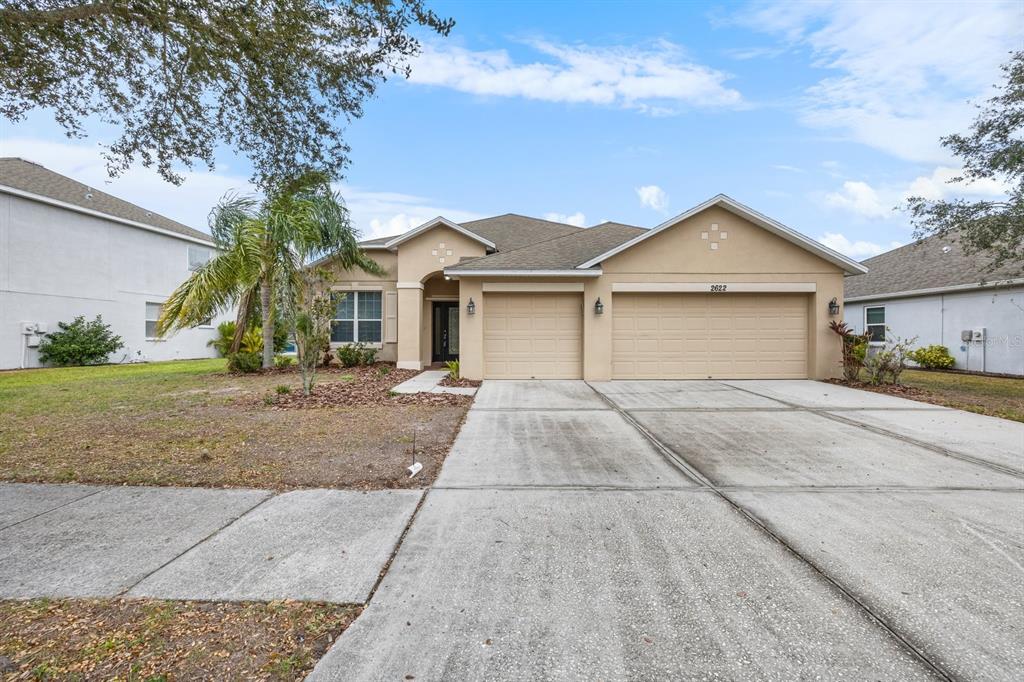 front view of a house with a yard