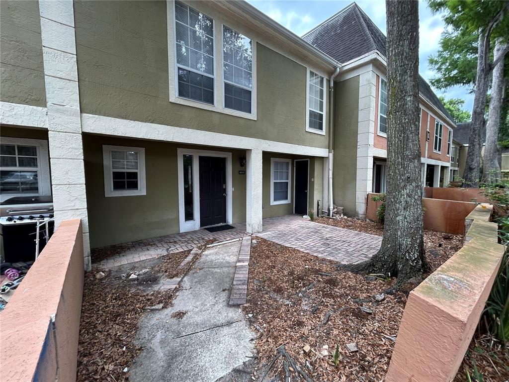 a view of a house with a yard