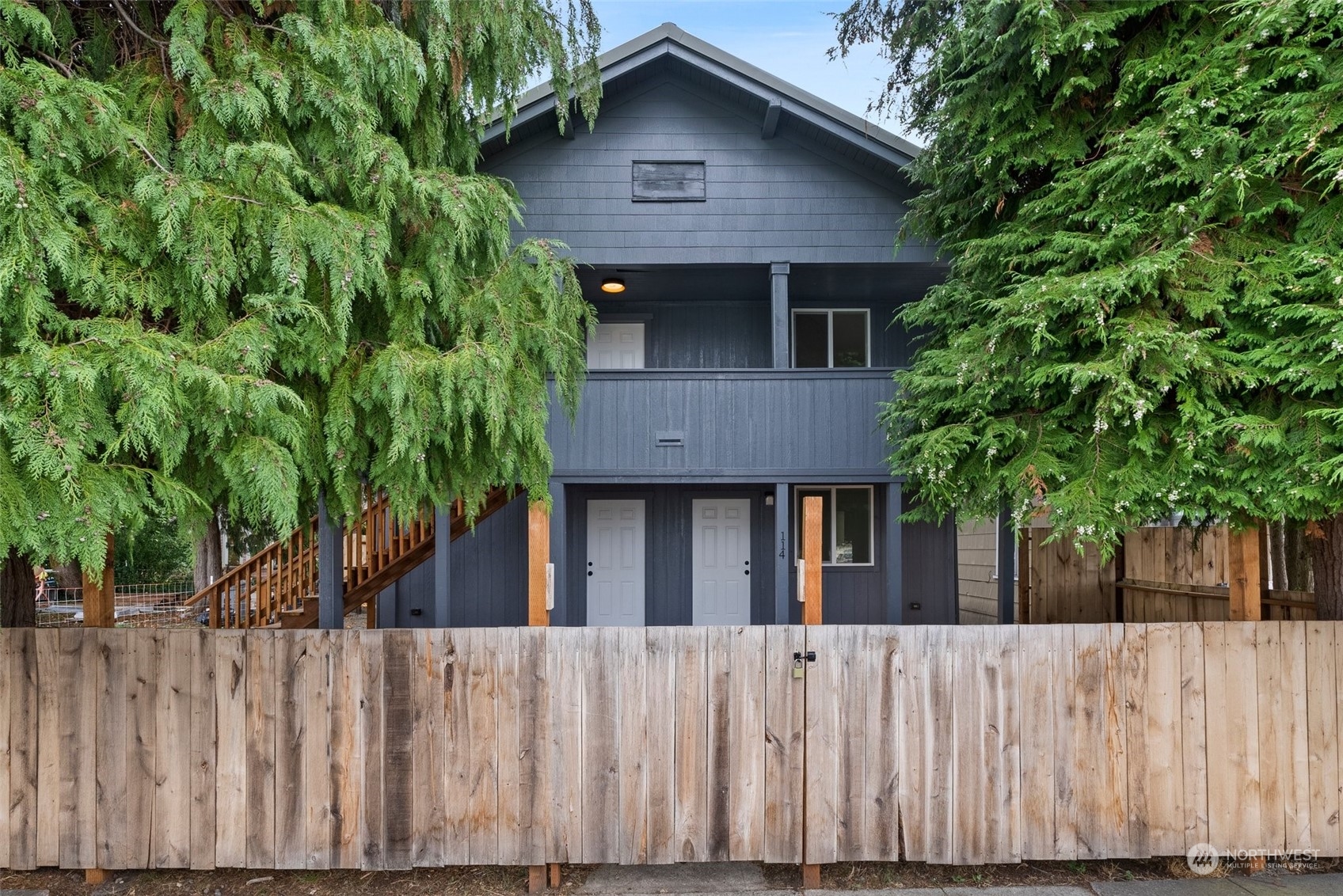 a view of a house with a tree