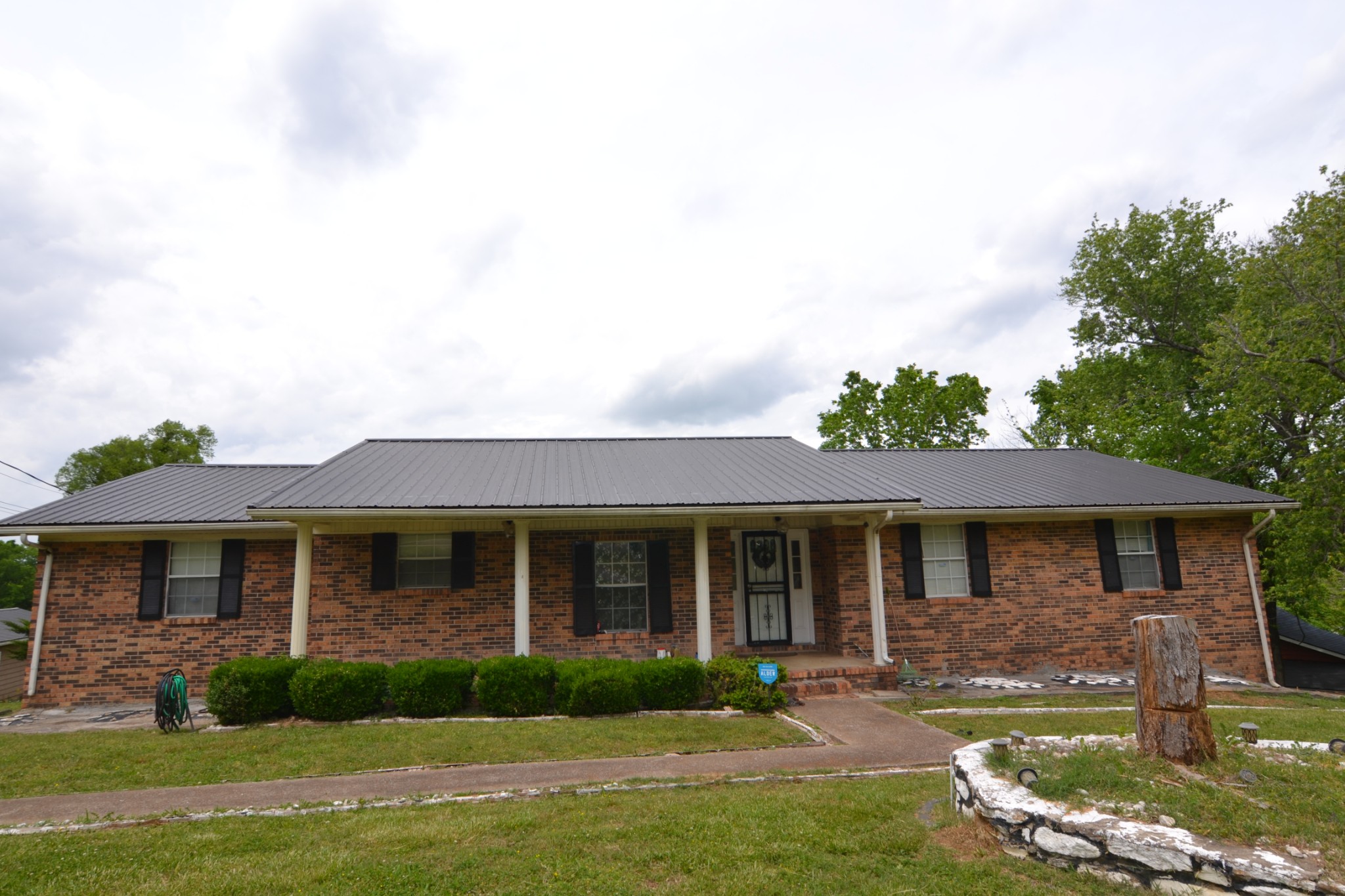 front view of a house with a yard