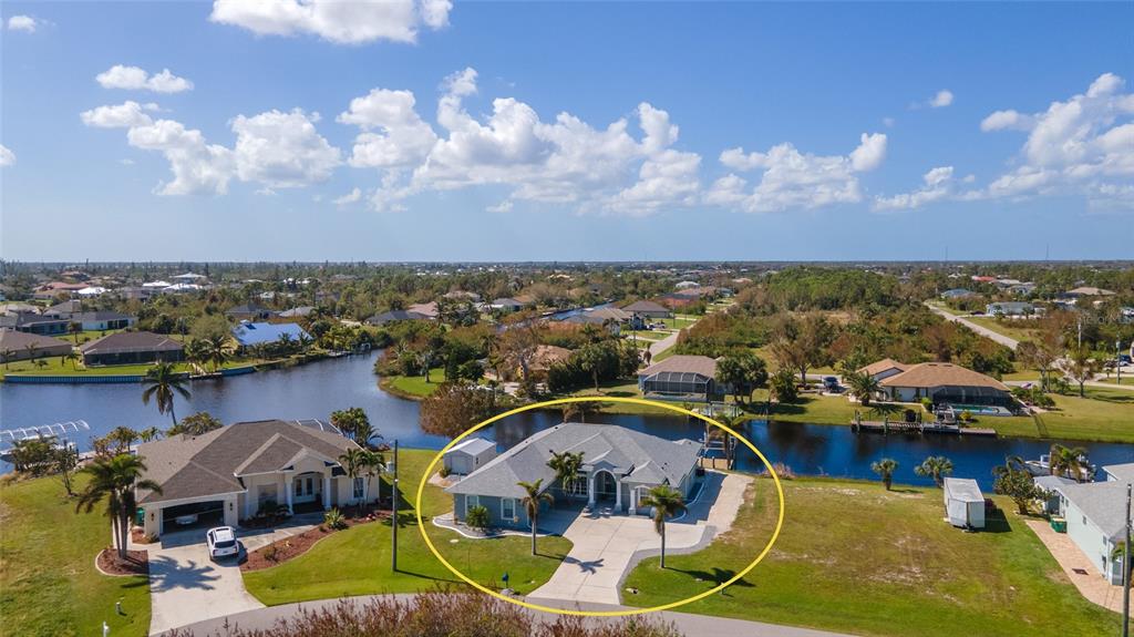 an aerial view of a house with a swimming pool yard and outdoor seating